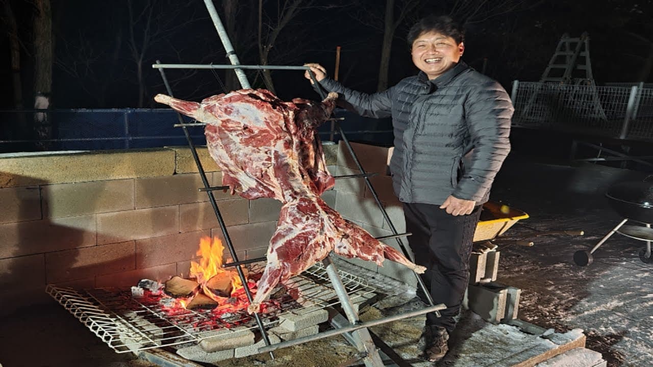아르헨티나 전통 아사도 (양 한 마리 통구이)